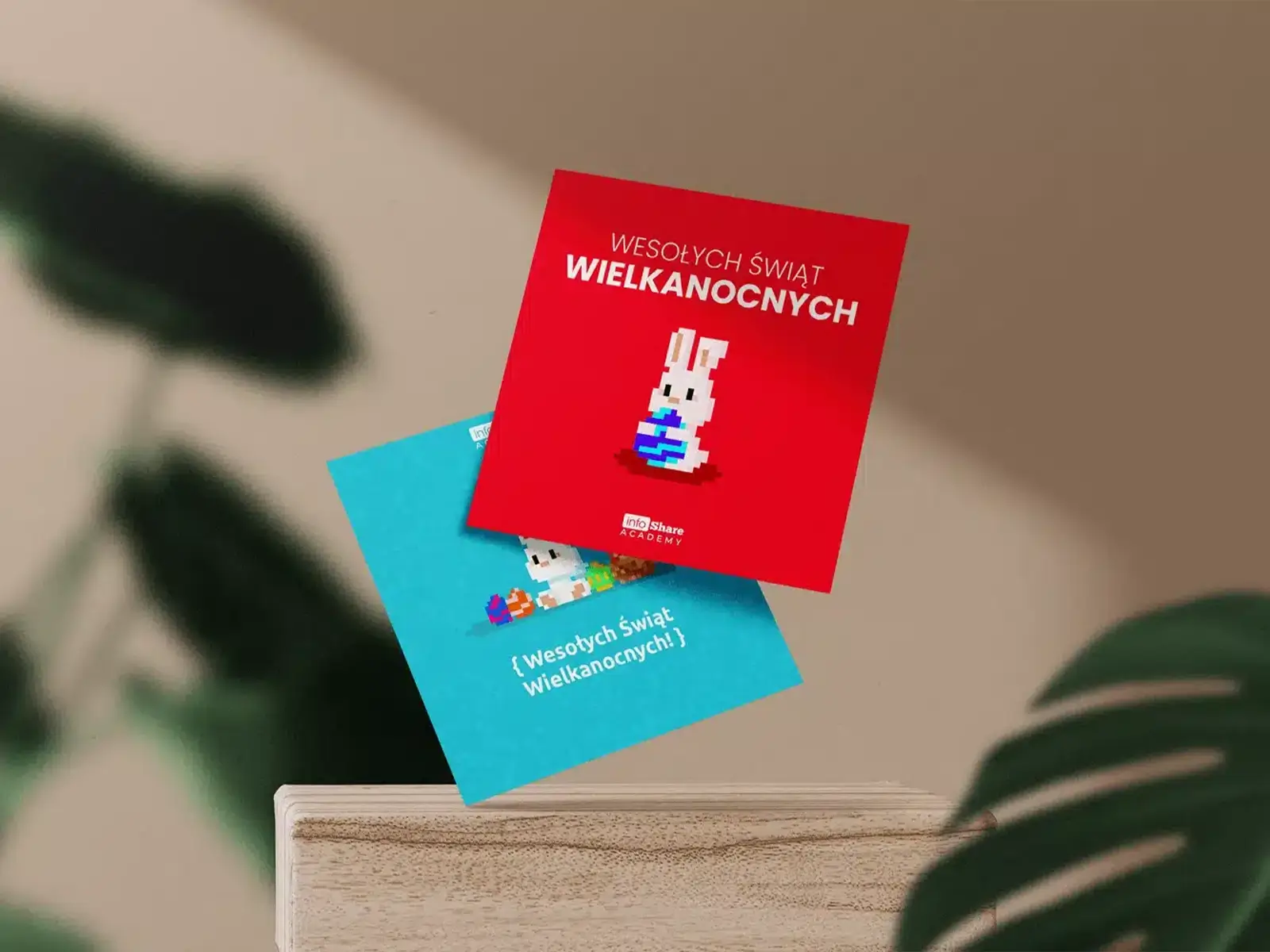 Projekt kartki wielkanocnej dla infoShare Academy z pikselowym królikiem, pisanką i kolorową grafiką nawiązującą do szkoły programowania